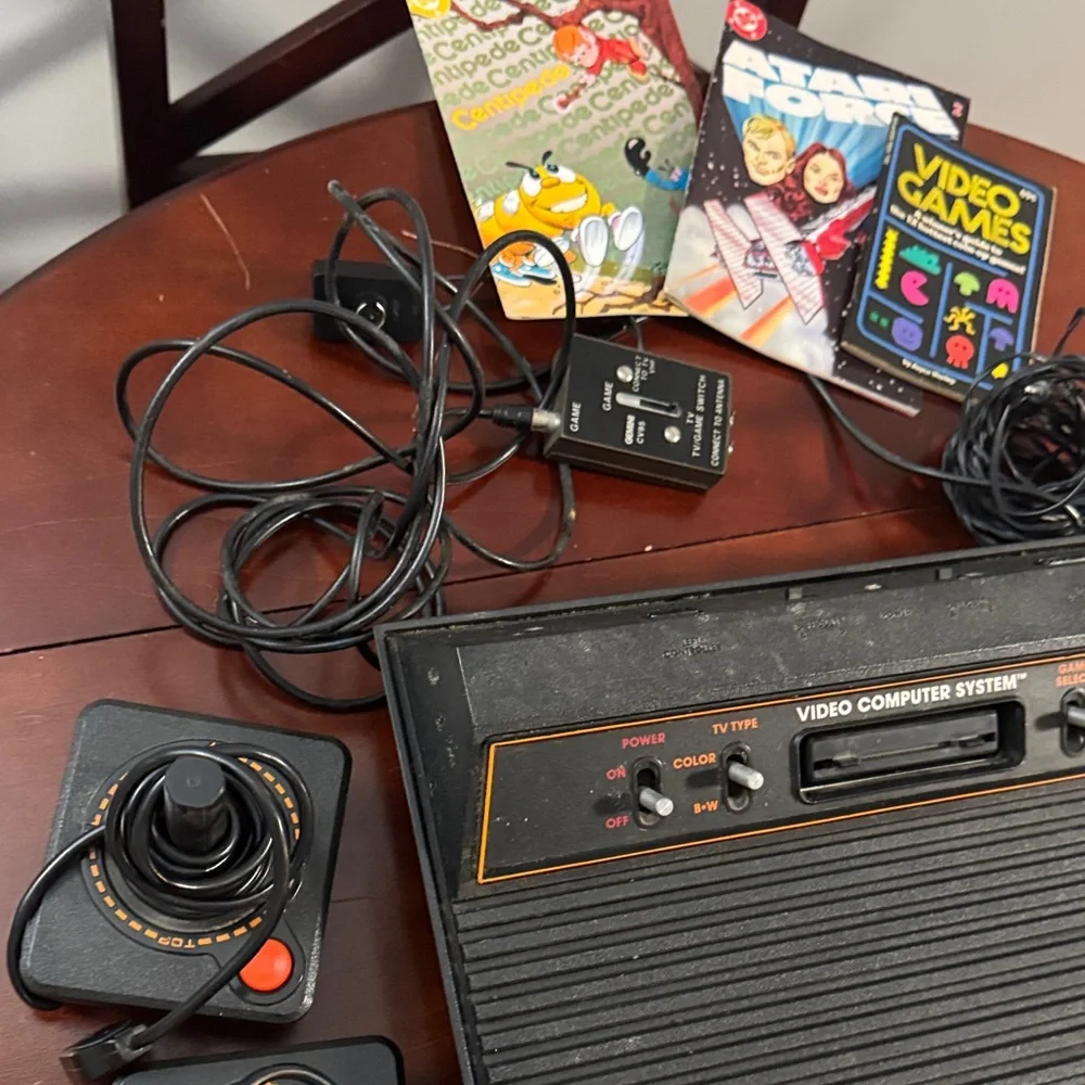 Vintage Authentic Atari 2600 with controllers, games and instruction booklets.